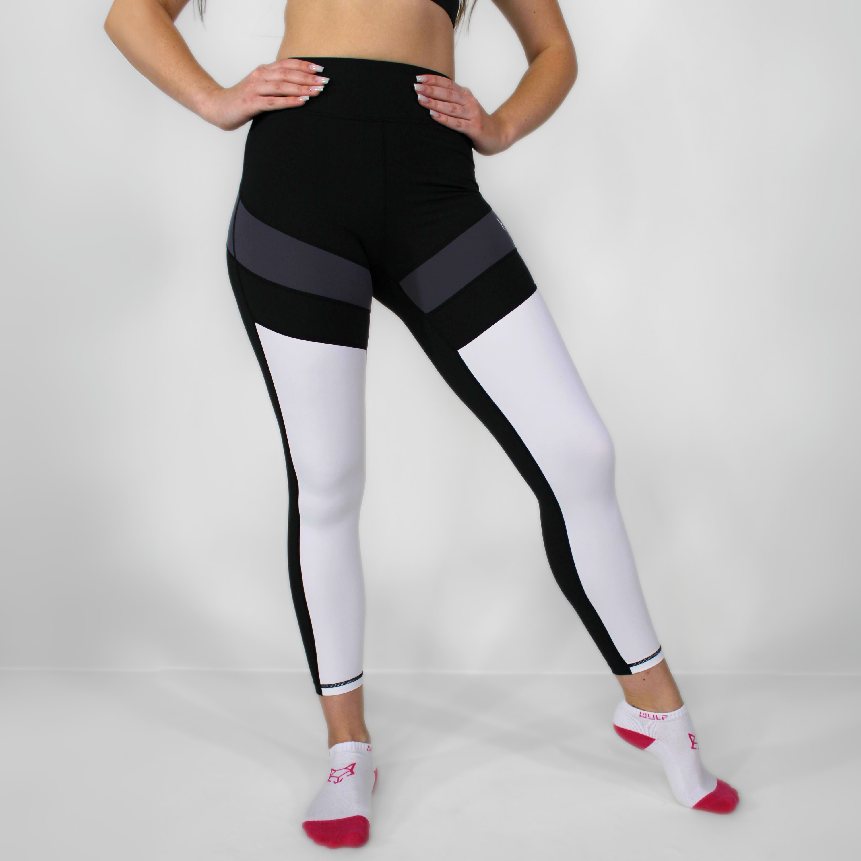 WULF Women's High Waisted Leggings, the epitome of high-end athletic wear that effortlessly combines style and functionality. Engineered to keep you securely supported during intense sprints, invigorating sweat sessions, and empowering squats, these sports leggings create a flawless, figure-hugging silhouette that enhances your confidence with every single step.