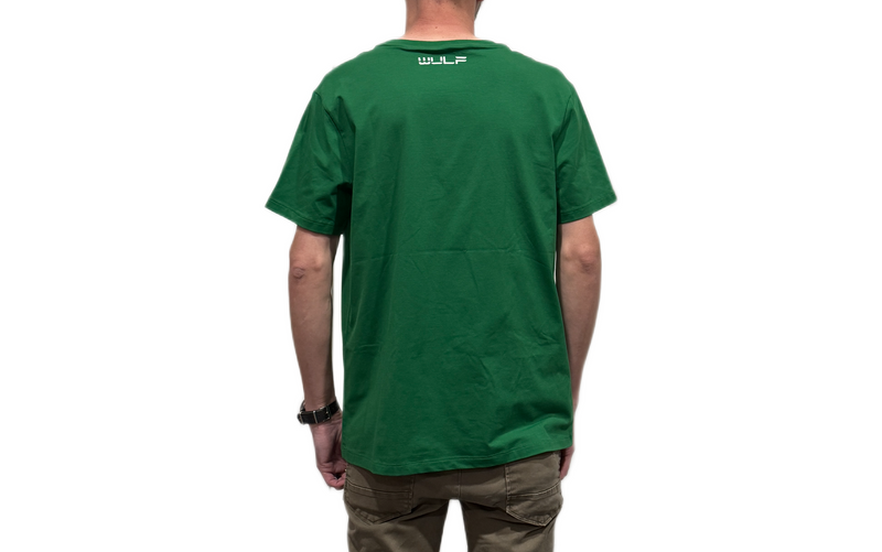 Person wearing a green t-shirt with a logo on the back, standing against a white background